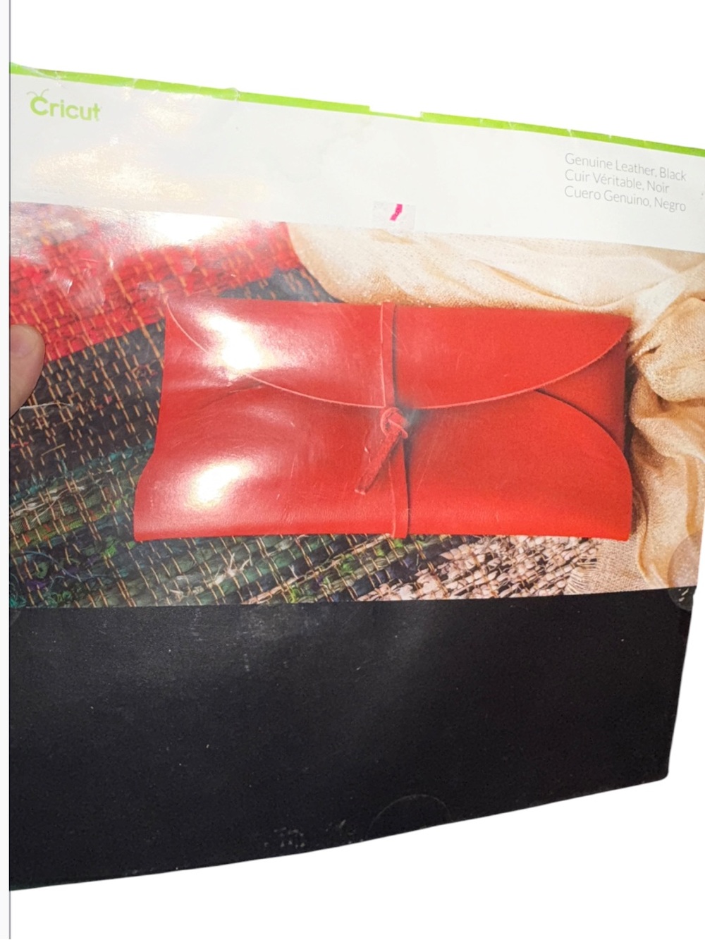 sheet of Cricut Genuine Leather featuring a smooth surface and a vibrant red fin